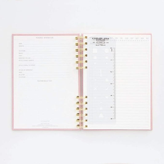 DesignWorks Ink Standard Issue Notebook No. 12 – 6" x 8.25" Undated Daily Planner & Writing Journal, 192 Lined Pages, Elastic Pen Holder, Small Spiral Notebook for Work & Journaling - Dusty Pink