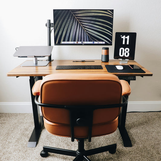 Focusory modern ergonomic desk setup with adjustable standing desk, monitor, and leather chair for productivity