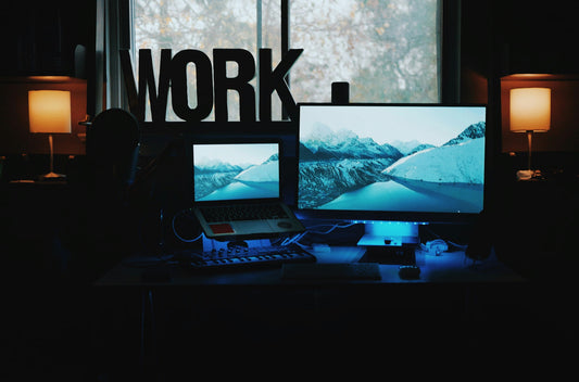Focusory thumbnail of a professional working at a tidy desk with notebook and lamp, representing productivity and flow state