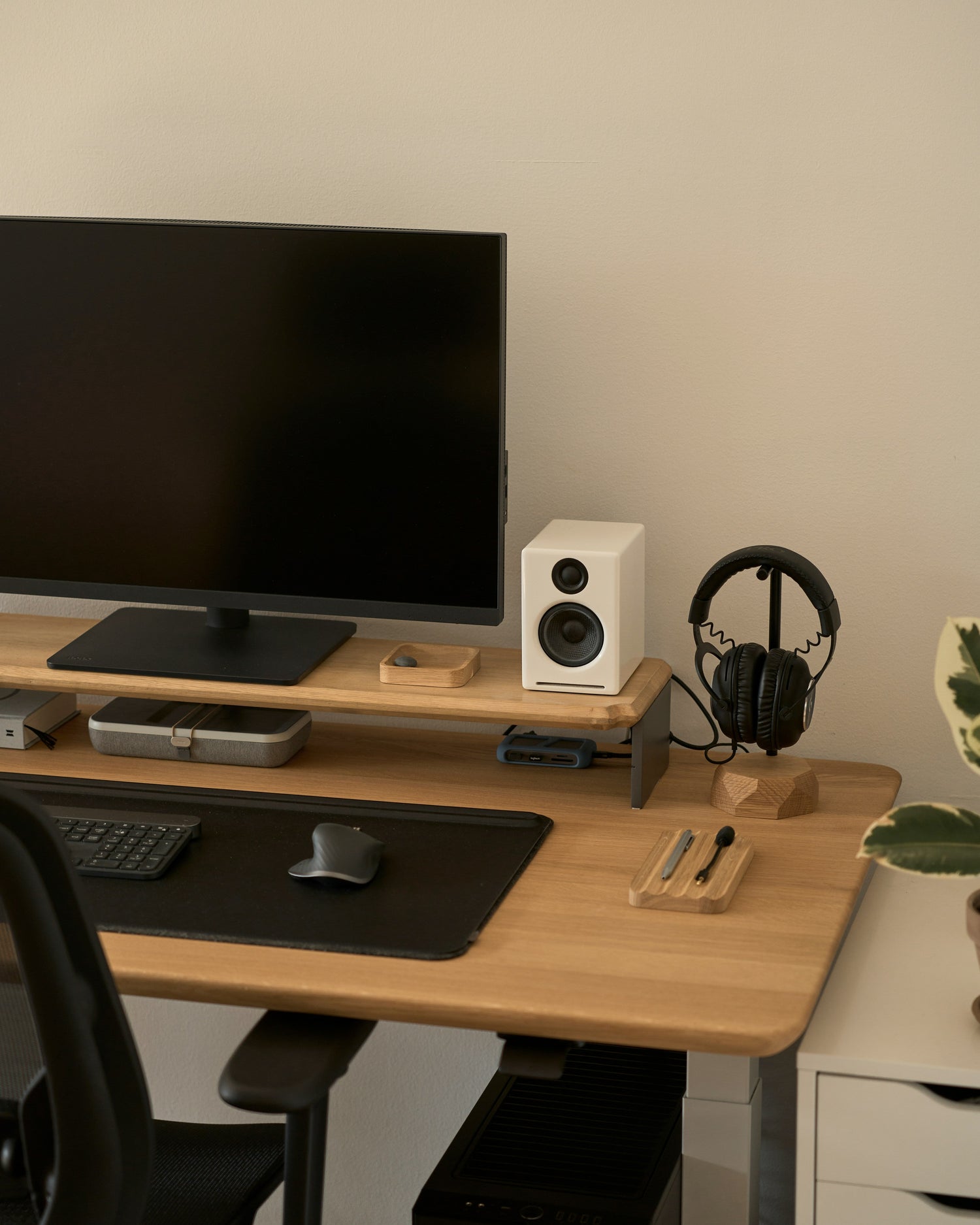 Laptop and screen risers for ergonomic and organized desk setups
