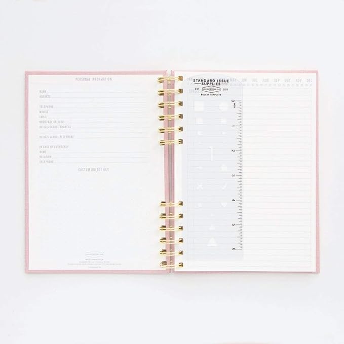 DesignWorks Ink Standard Issue Notebook No. 12 – 6" x 8.25" Undated Daily Planner & Writing Journal, 192 Lined Pages, Elastic Pen Holder, Small Spiral Notebook for Work & Journaling - Dusty Pink