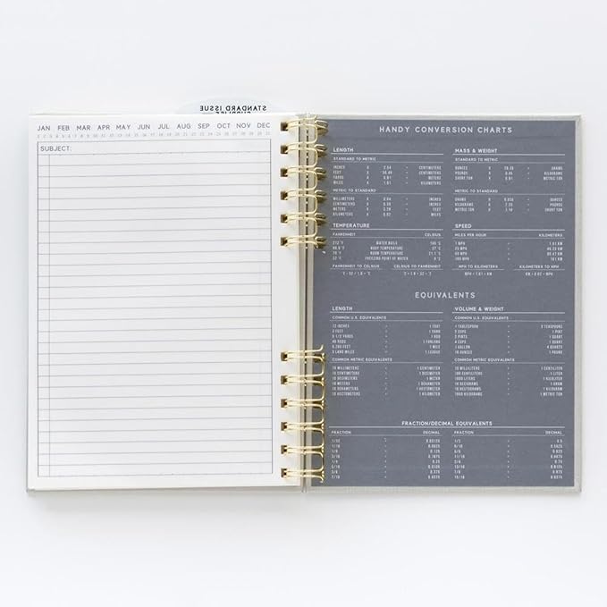 DesignWorks Ink Standard Issue Notebook No. 12 – 6" x 8.25" Undated Daily Planner & Writing Journal, 192 Lined Pages, Elastic Pen Holder, Small Spiral Notebook for Work & Journaling - Black